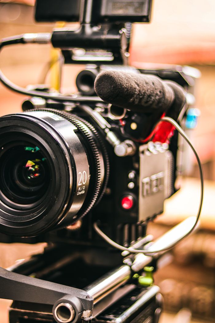 Home Detailed view of a professional video camera setup with attached microphone for videography.